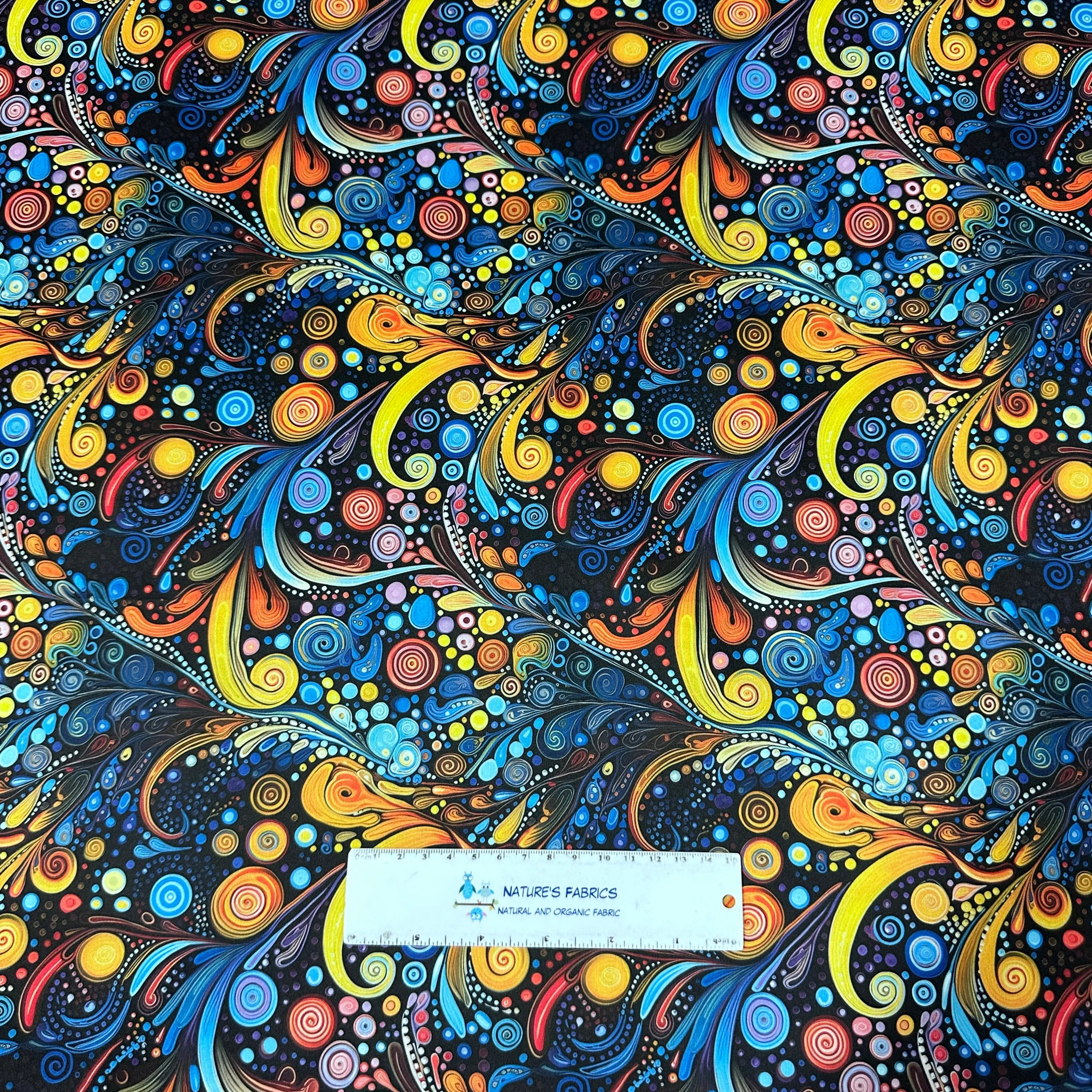 Blue, Orange and Yellow Swirls 1 mil PUL Fabric - Made in the USA