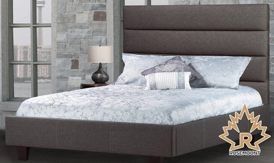 Upholstered Bed Featuring lofty tufted panels